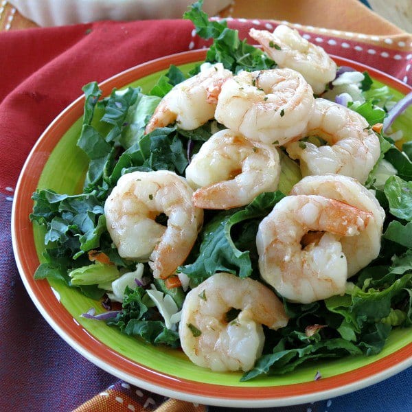 Skillet Shrimp on top of salad salad greens