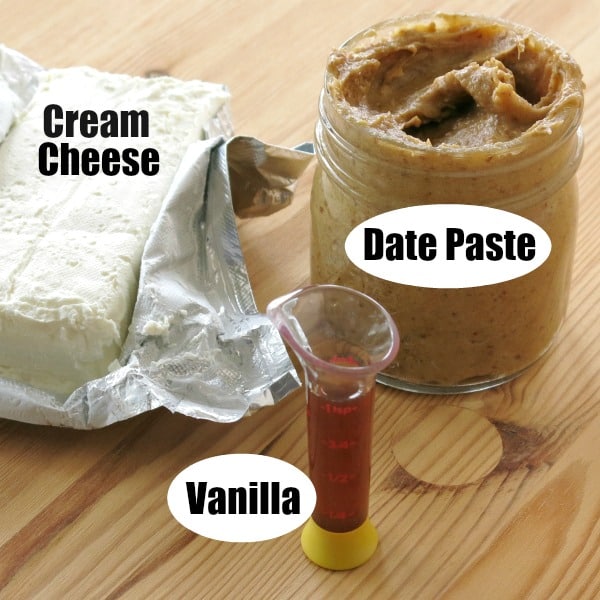 Graphic showing ingredients in healthy cream cheese frosting with labels on cream cheese, date paste and vanilla.