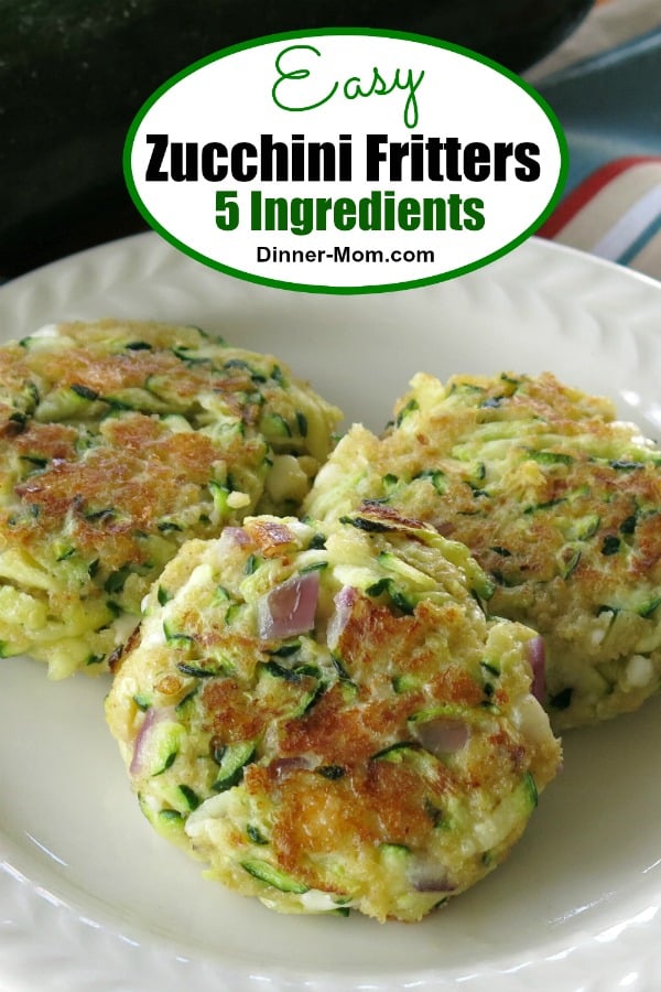 There are just 5 ingredients in these Zucchini Fritters including tangy feta cheese! Easy, healthy recipe that's ready in minutes! #zucchinifritters