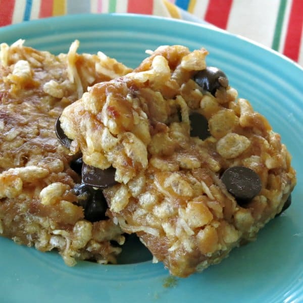 Two Almond Butter Rice Krispies Treats on a blue plate.