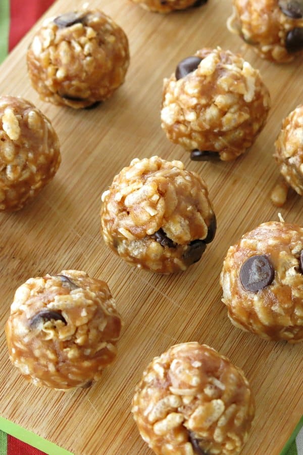 Rice Krispies Date Balls on a cutting board.