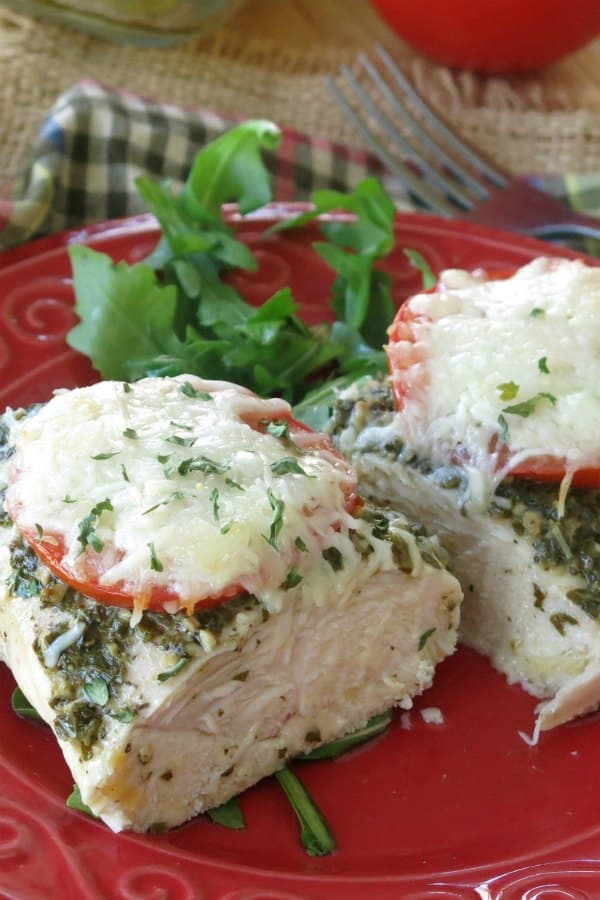 Healthy Chicken Pesto Recipe on plate cut in half