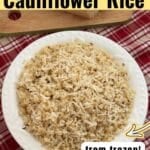 Roasted cauliflower rice made with frozen riced cauliflower, garlic and Parmesan cheese in a white bowl.