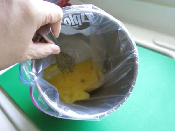 Ingredients for quiche in plastic bag stabilized in metal tin