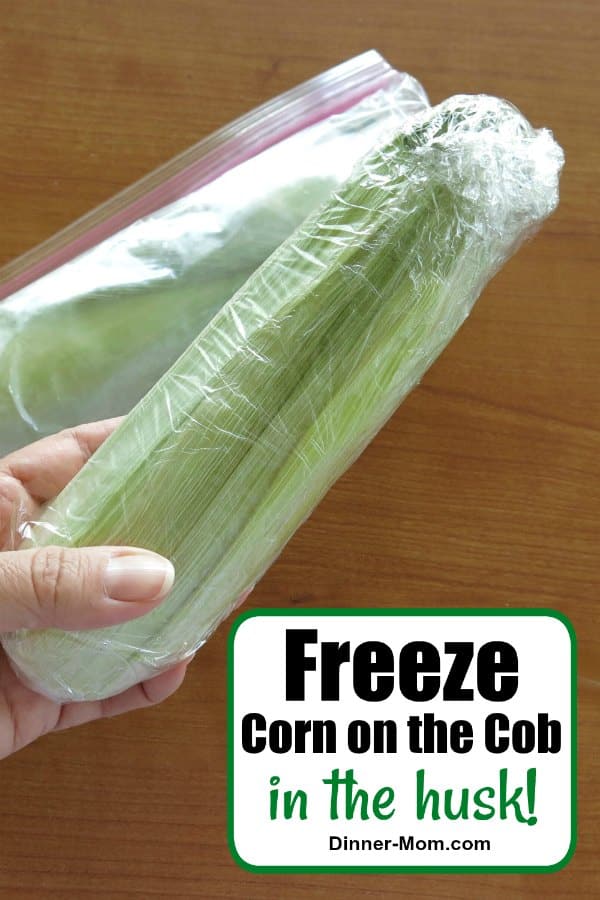 Corn on the Cob in the husk wrapped in plastic and ready to go into the freezer