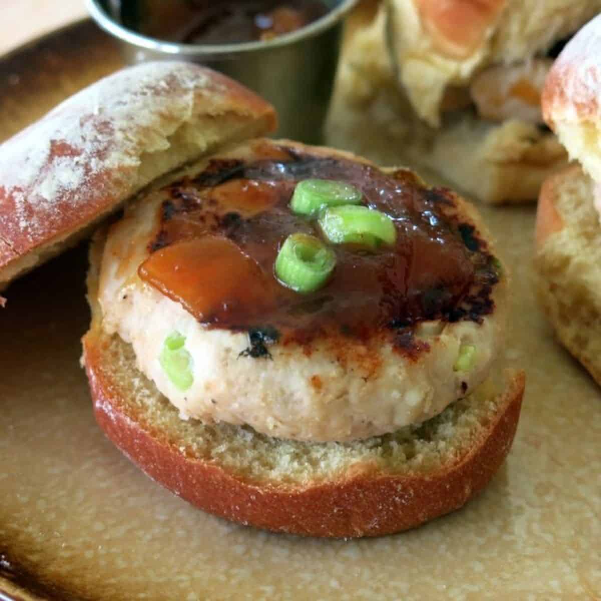 Mango Chutney Turkey Burger in a bun on a plate.