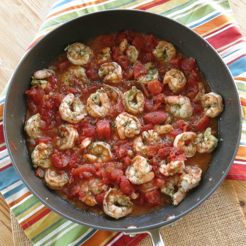 Greek Shrimp and Tomatoes in a skillet.