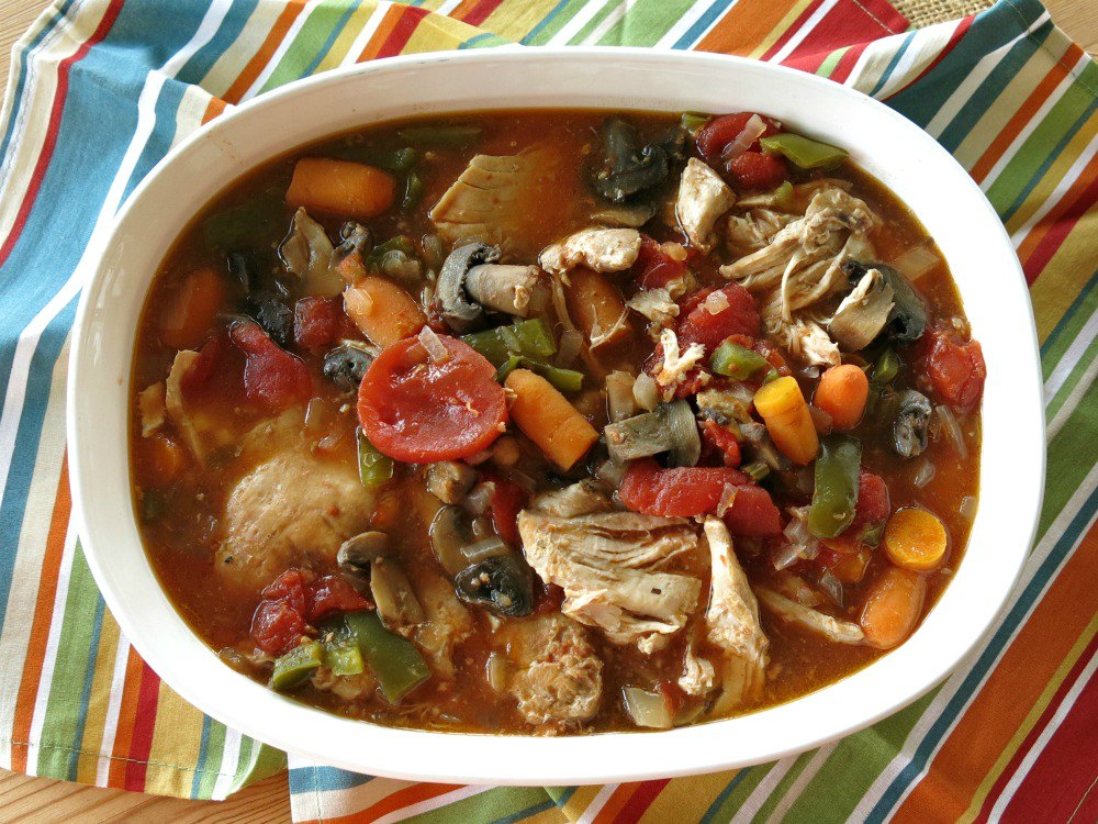 Serving dish with cooked chicken cacciatore.