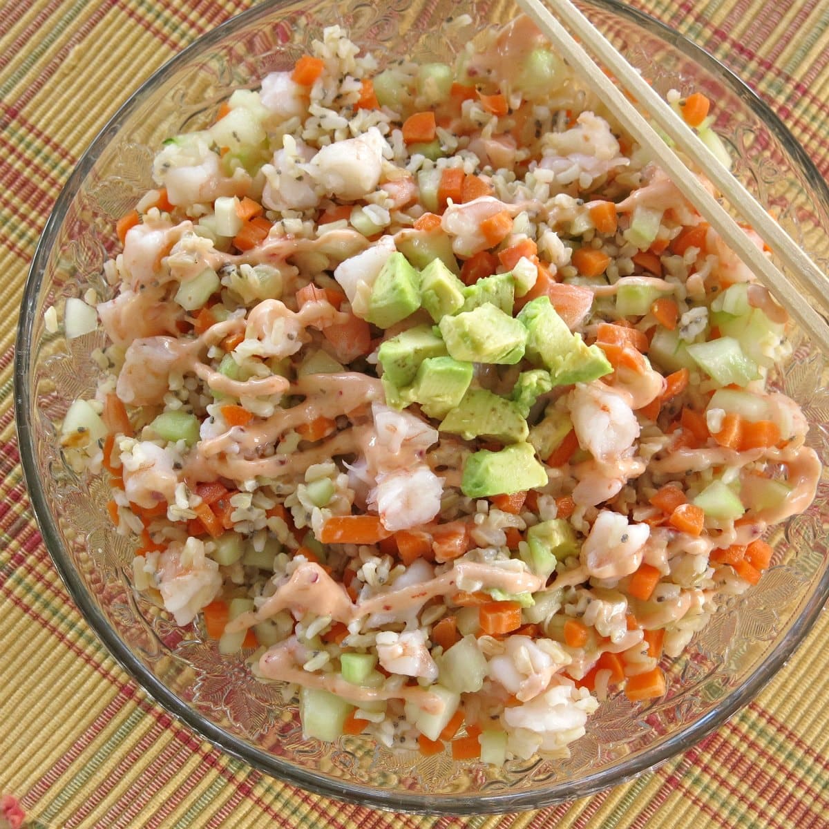 Bowl with finished dish with two chopsticks