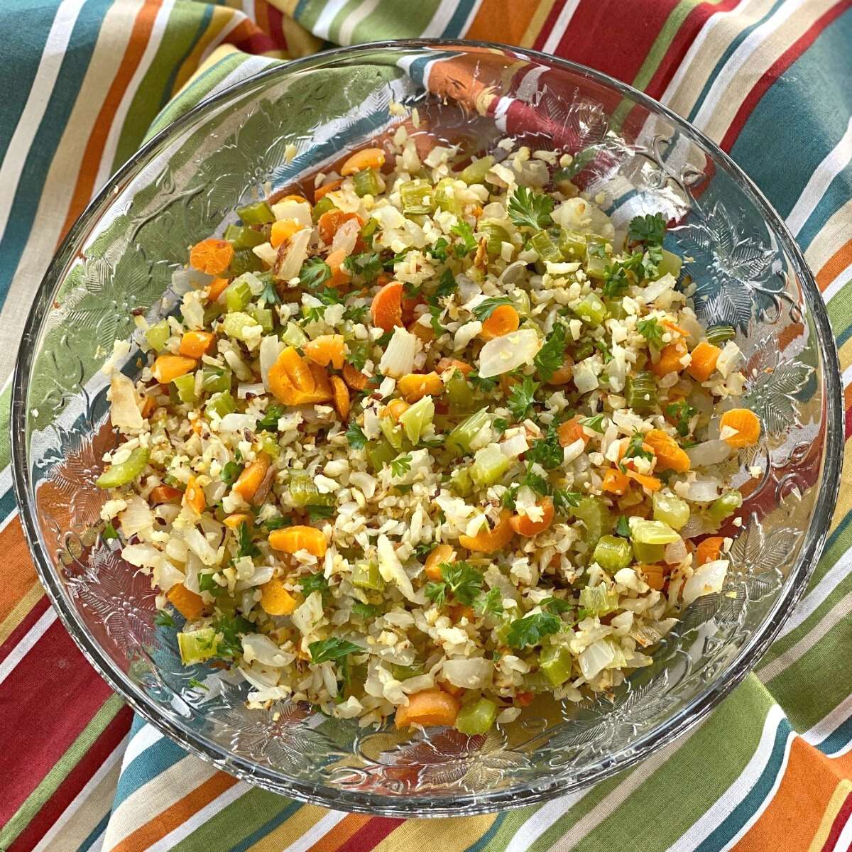 Cauliflower rice pilaf with vegetables in a bowl.