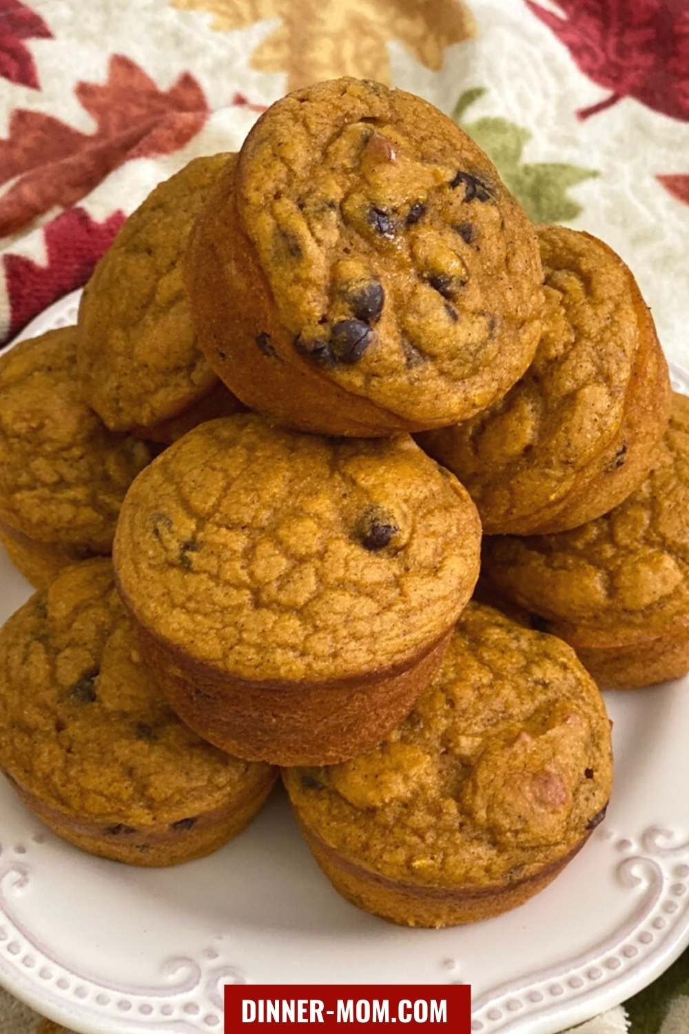 Pumpkin Muffins stacked on a plate.