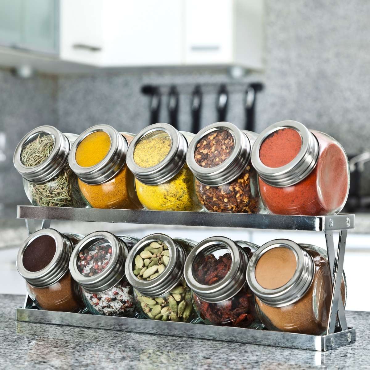 Spices organized on a spice rack in a kitchen