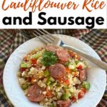 Bowl of Cajun Cauliflower Rice and sausage with fork on side and title on the top.