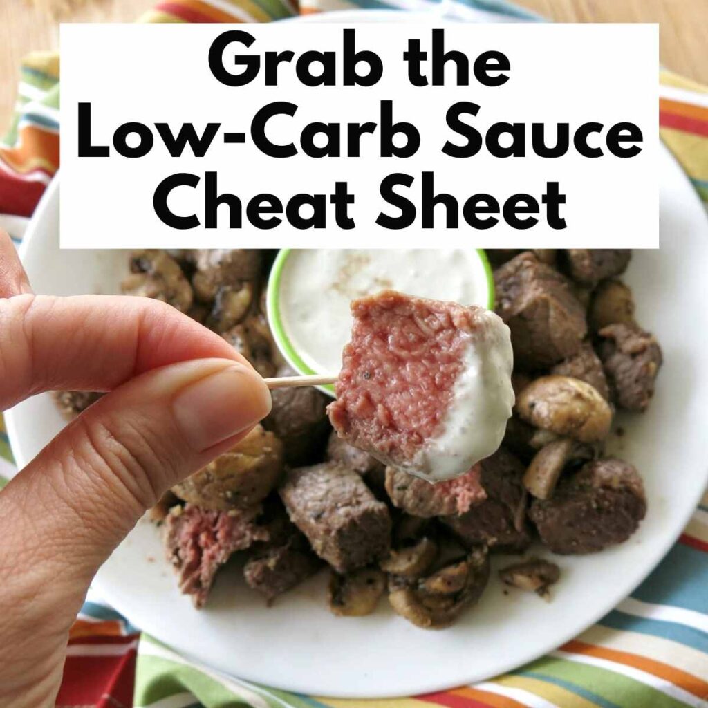 Steak dipped into sauce with text that says grab the low-carb sauce cheat sheet.