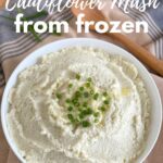 Frozen cauliflower mash in a bowl with title above it.
