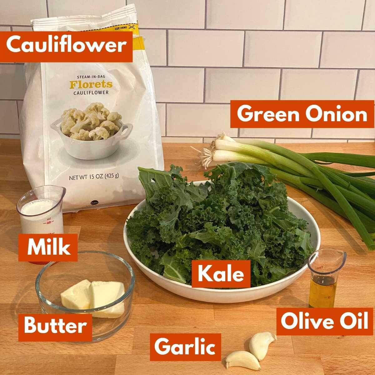 Graphic with ingredients to make cauliflower colcannon recipe: cauliflower floriets, kale, spring onions, milk, butter, olive oil, and garlic.