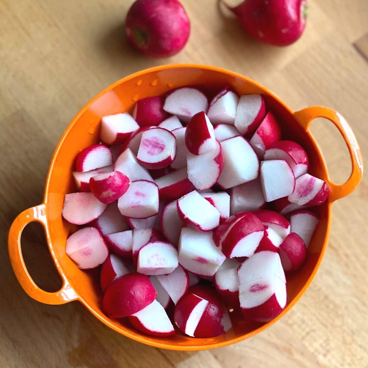 Diced radishes in a bowl.