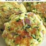 Three zucchini cakes on a plate with text overlay that says: Fried Zucchini Cakes - Just 5 ingredients.