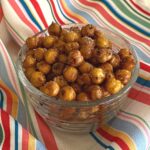 Sweet and spicy roasted chickpeas in a glass bowl.