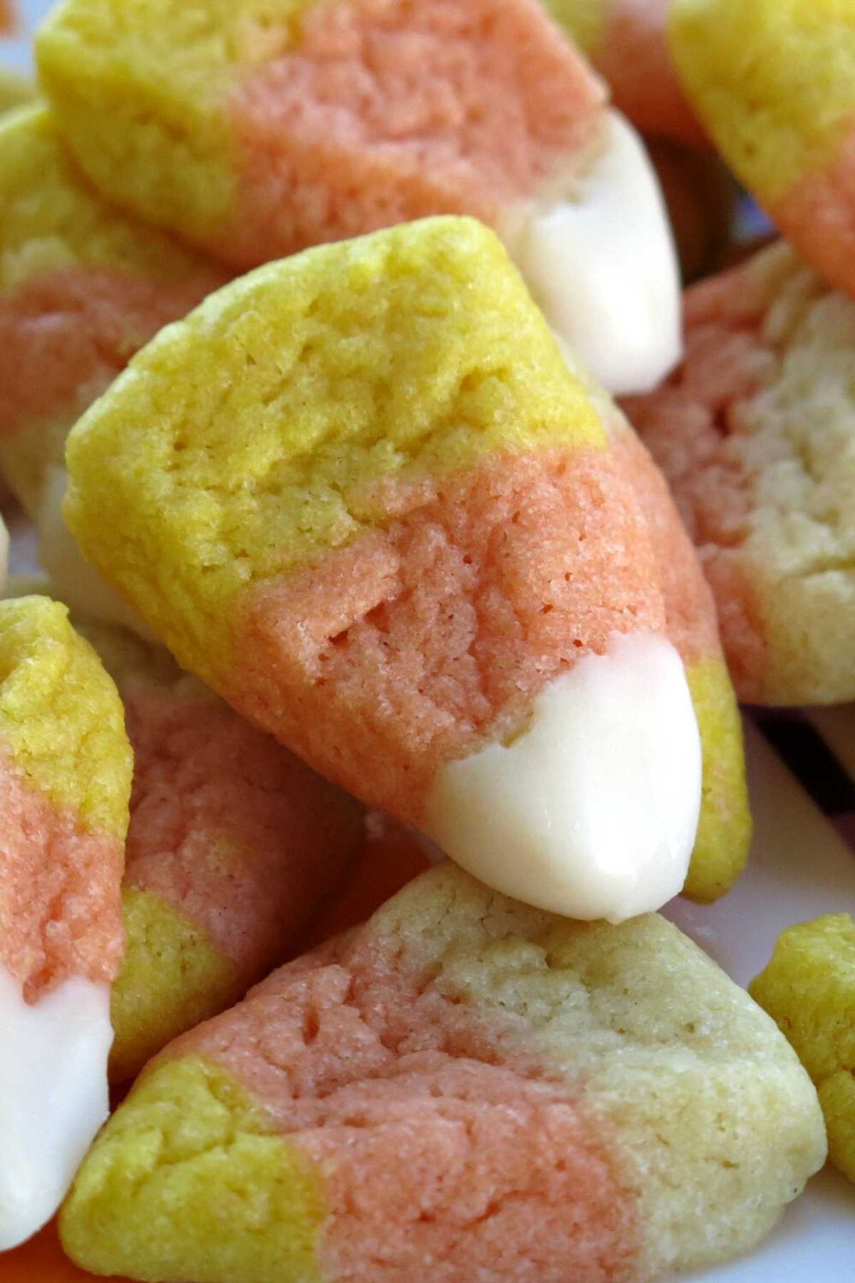 Close-up picture of Candy Corn cookie with a frosted tip.