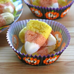 Vegan Candy Corn Sugar Cookies in a paper insert.