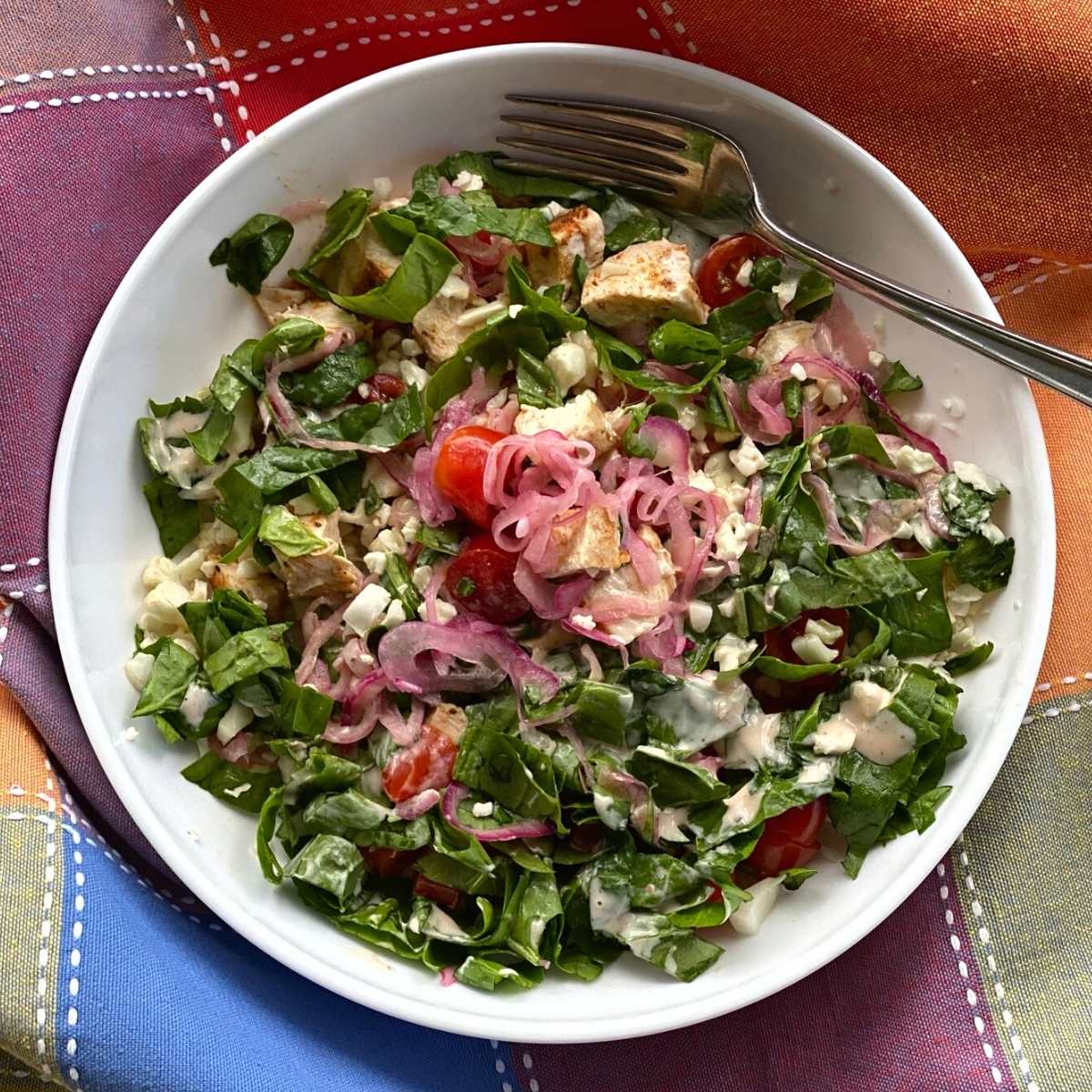 Chicken Shawarma Bowl topped with quick pickled pink onions.