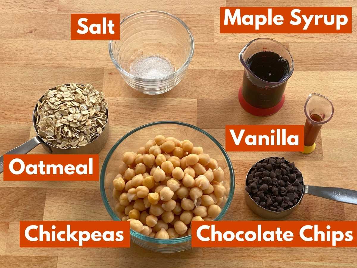 Labeled ingredients to make the recipe: chickpeas, oatmeal, chocolate chips, vanilla extract, maple syrup, and salt.