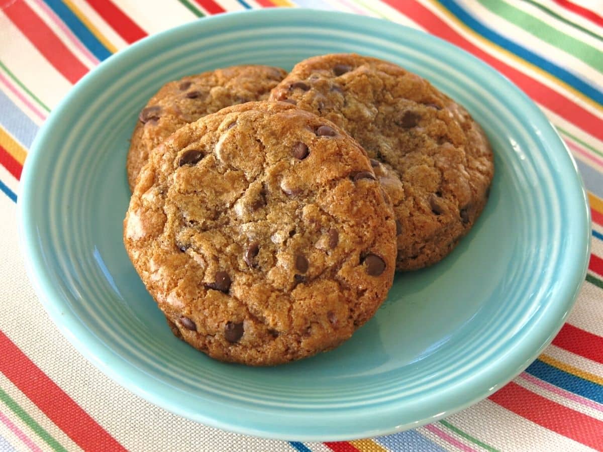 Three Brown Butter Chocolate Chip Cookies on a plate.