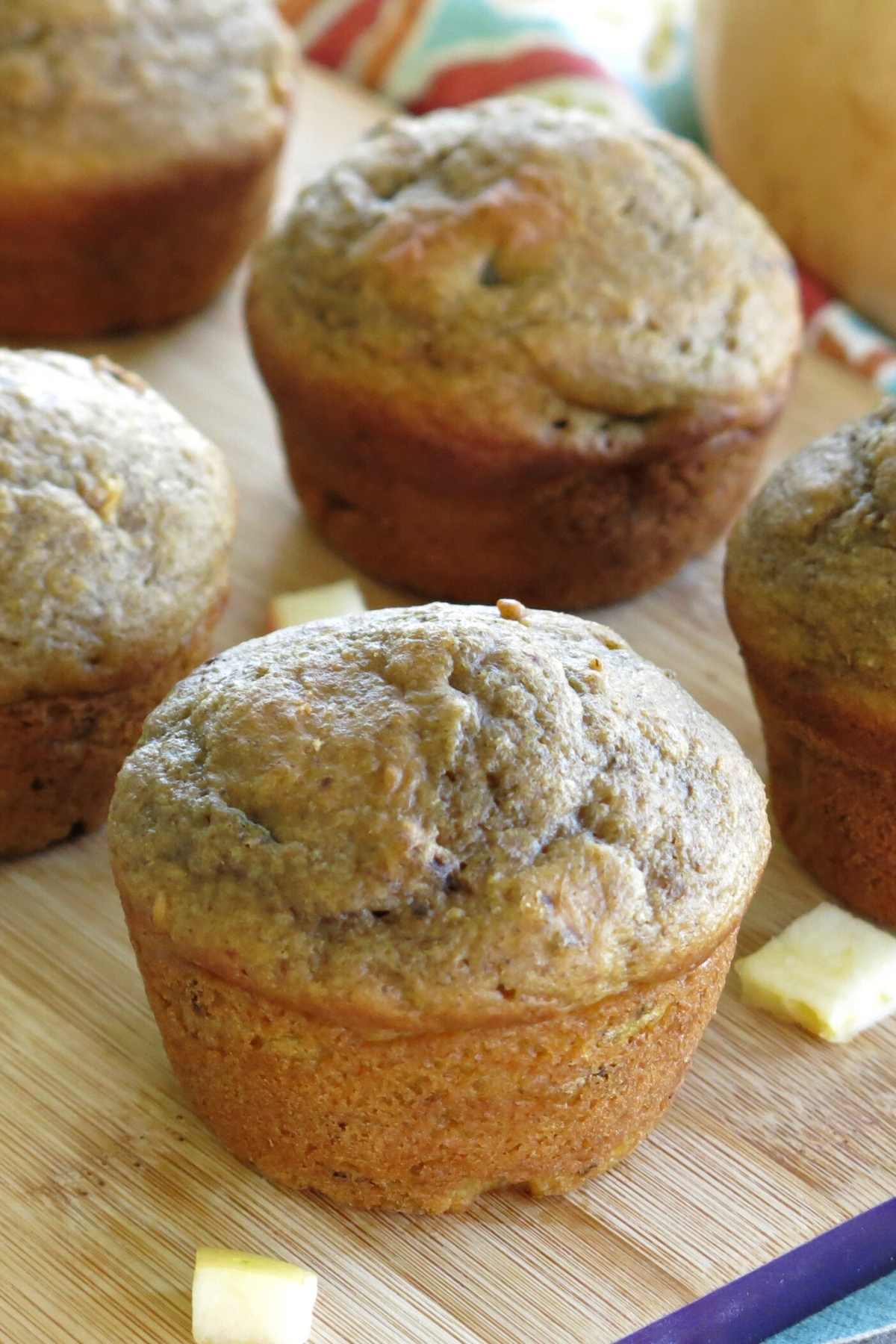 Butternut squash apple muffins on a serving board.