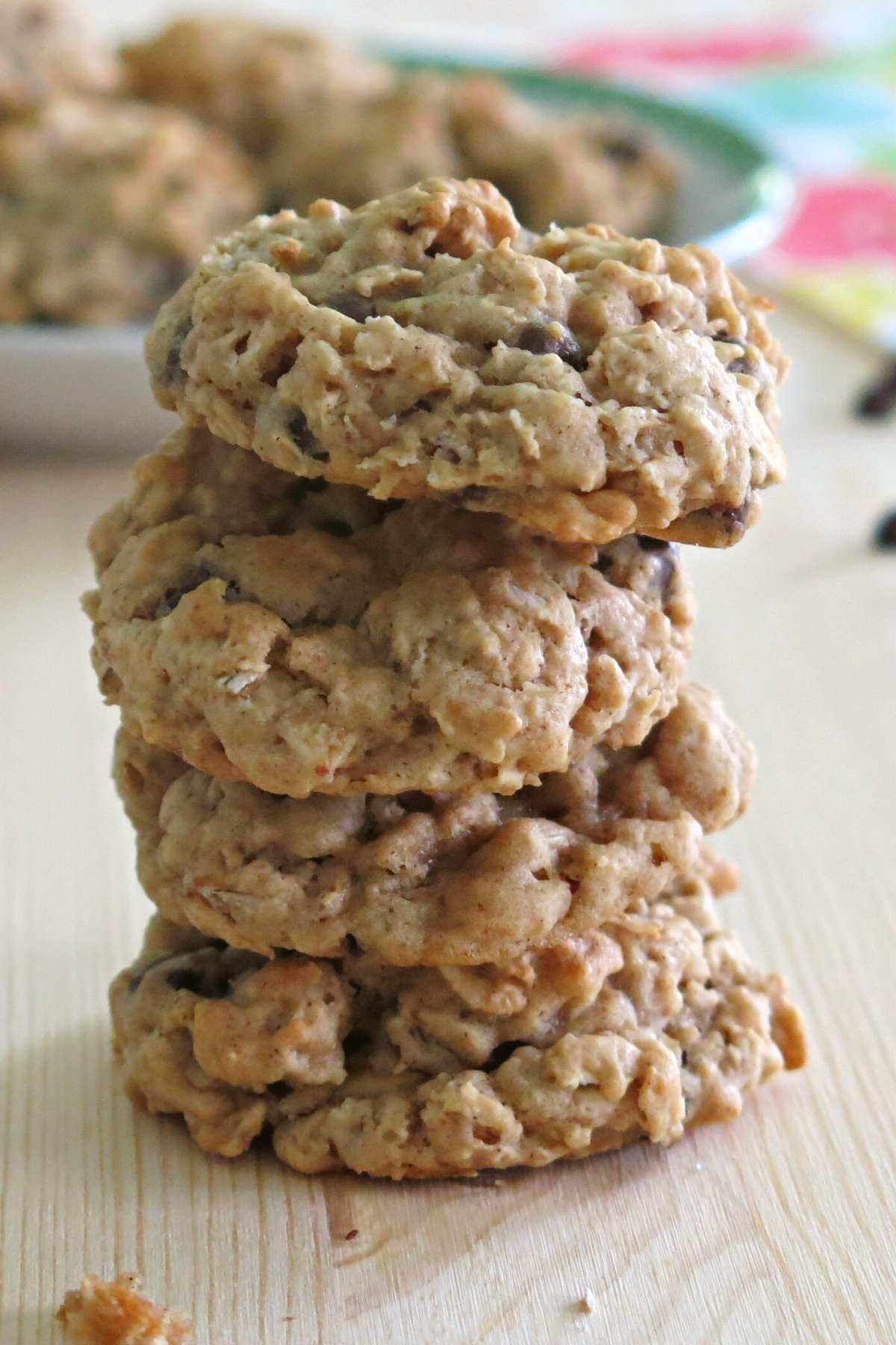 Eggless oatmeal chocolate chip cookies stacked on a counter.