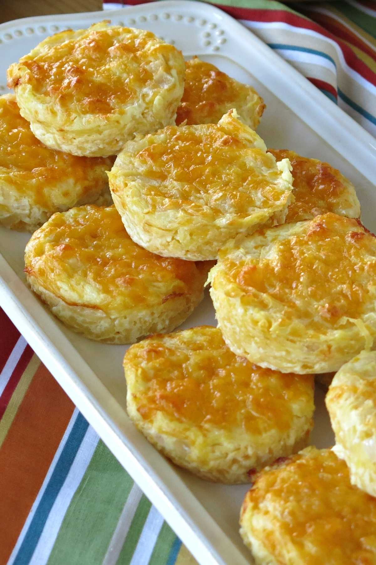 Spaghetti squash au gratin cups stacked on a serving platter.
