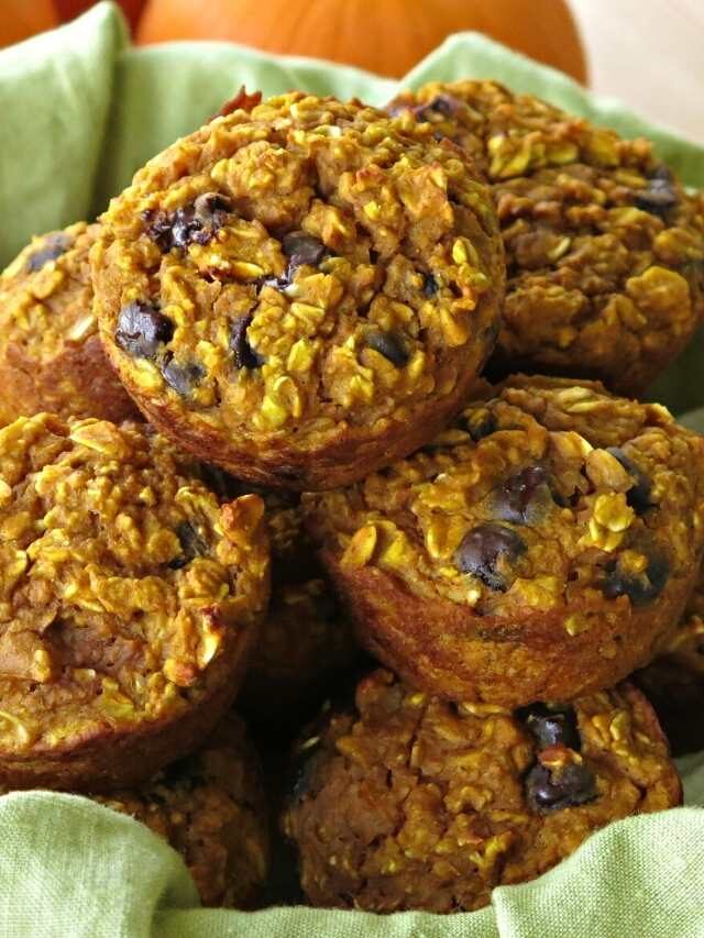 Healthy oatmeal pumpkin muffins stacked in a basket.