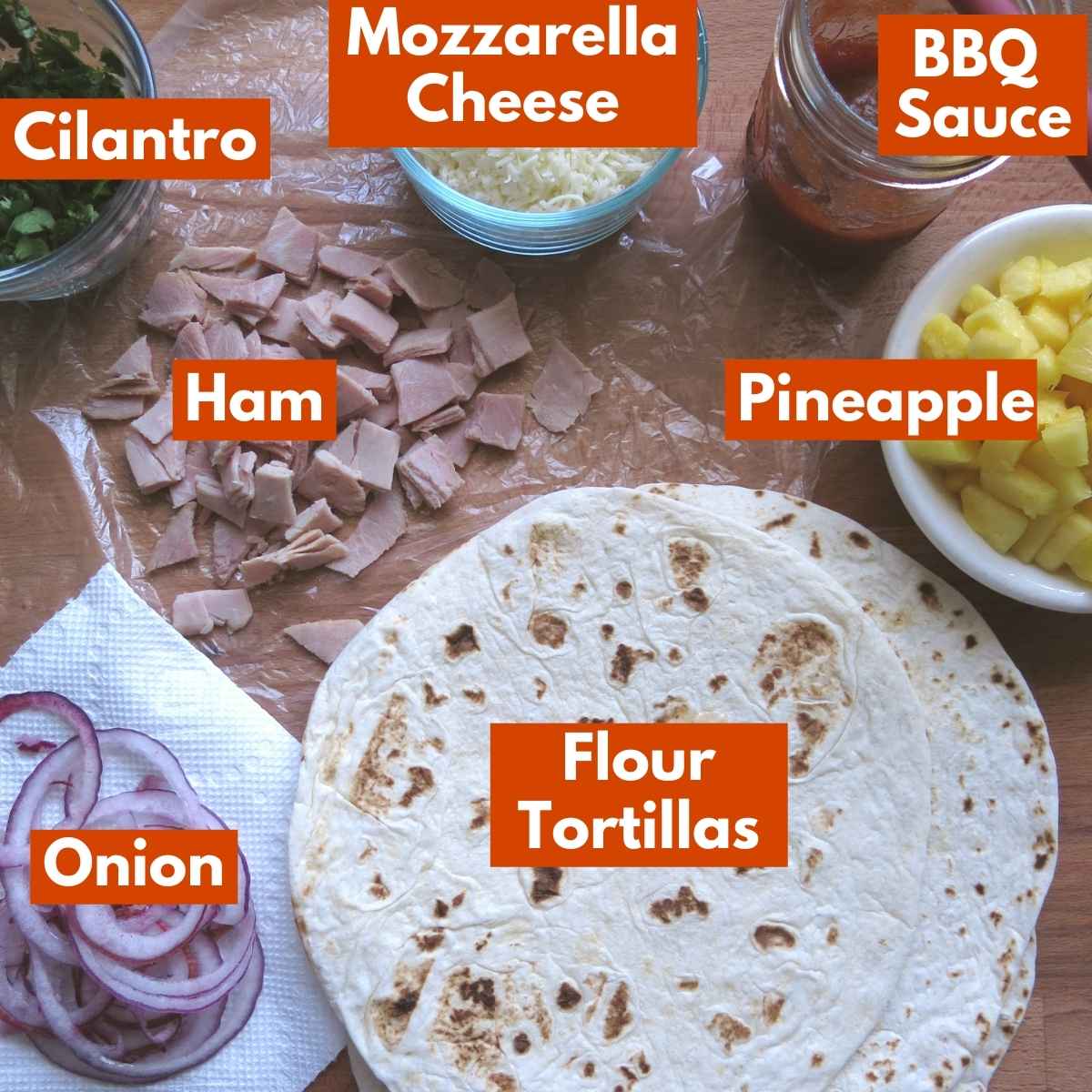 Labelled ingredients to make hawaiian cheese quesadillas.