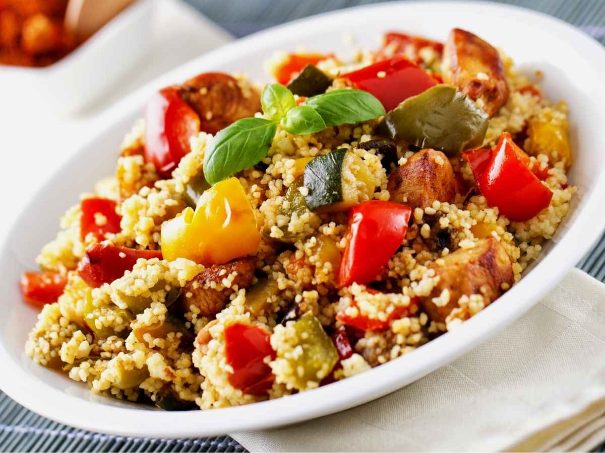 Couscous with vegetables in a serving bowl.