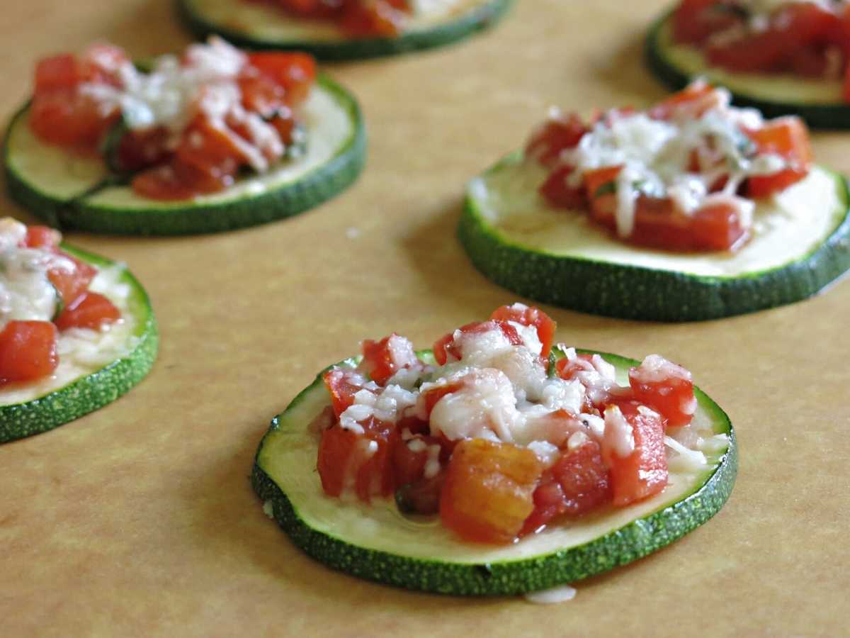 Zucchini bruschetta on a cutting board.
