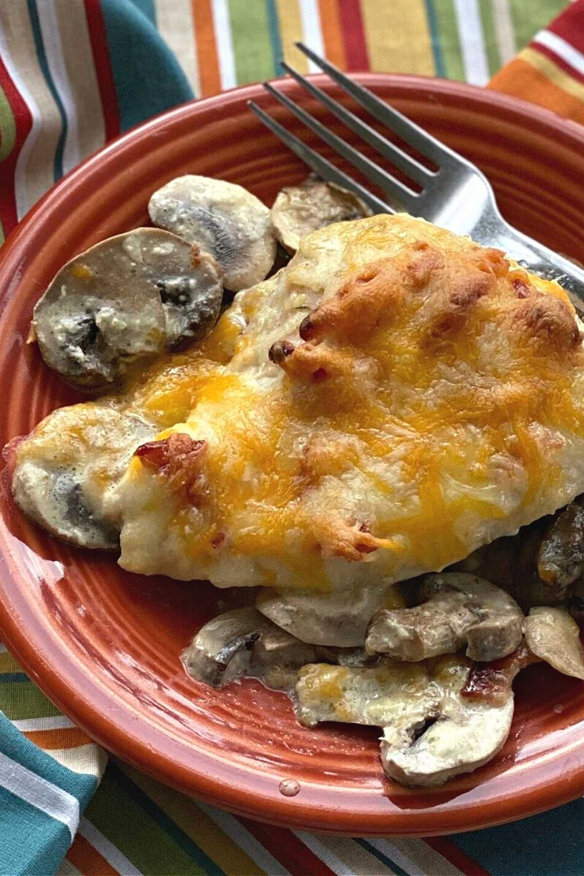 Homemade Alice Springs Chicken on a plate with extra mushrooms.