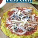 Spaghetti Squash Pizza Crust topped with pizza sauce, mushrooms, and cheese.