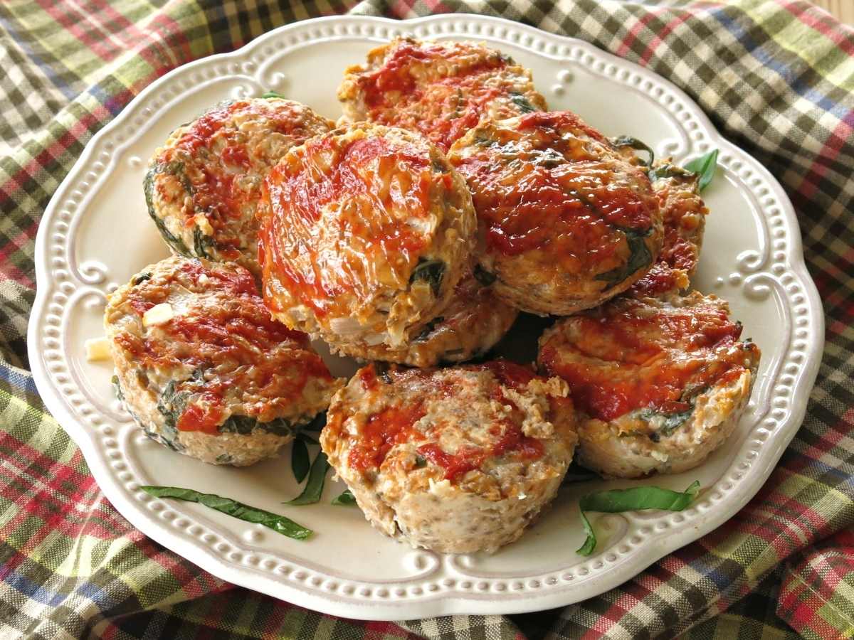 Plate of turkey salsa meatloaf muffins stacked on top of each other.