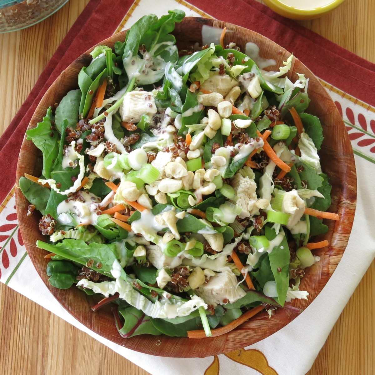 Kale quinoa salad with sesame aioli in a bowl.