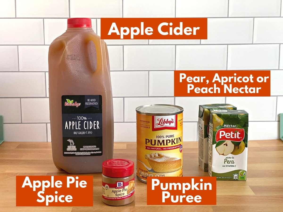 Labeled ingredients to make pumpkin juice: apple cider, pumpkin puree, apple pie spice, pear nectar.