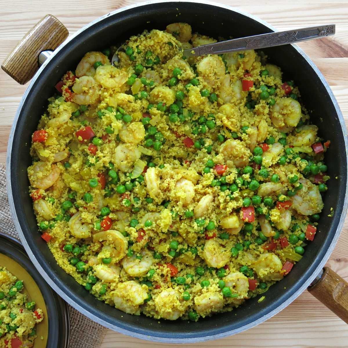 Shrimp and Couscous in a large skillet with a 2 inch rim.