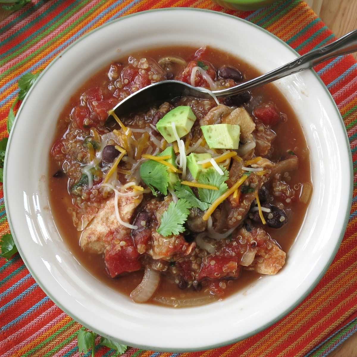 Slow cooker chicken quinoa soup in a bowl.