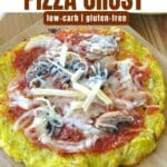 Spaghetti squash pizza crust topped with pizza sauce mushrooms and cheese on cutting board with text overlay.