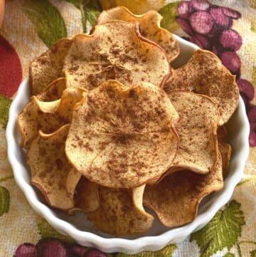 Plate of oven-baked dried apple chips.