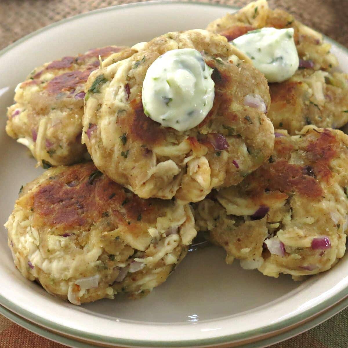 Plate with leftover chicken cakes made with shredded rotisserie chicken. 