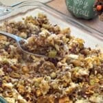 Make-ahead Oven Baked Stuffing made with fresh bread, apples, and pecans, in a casserole dish.