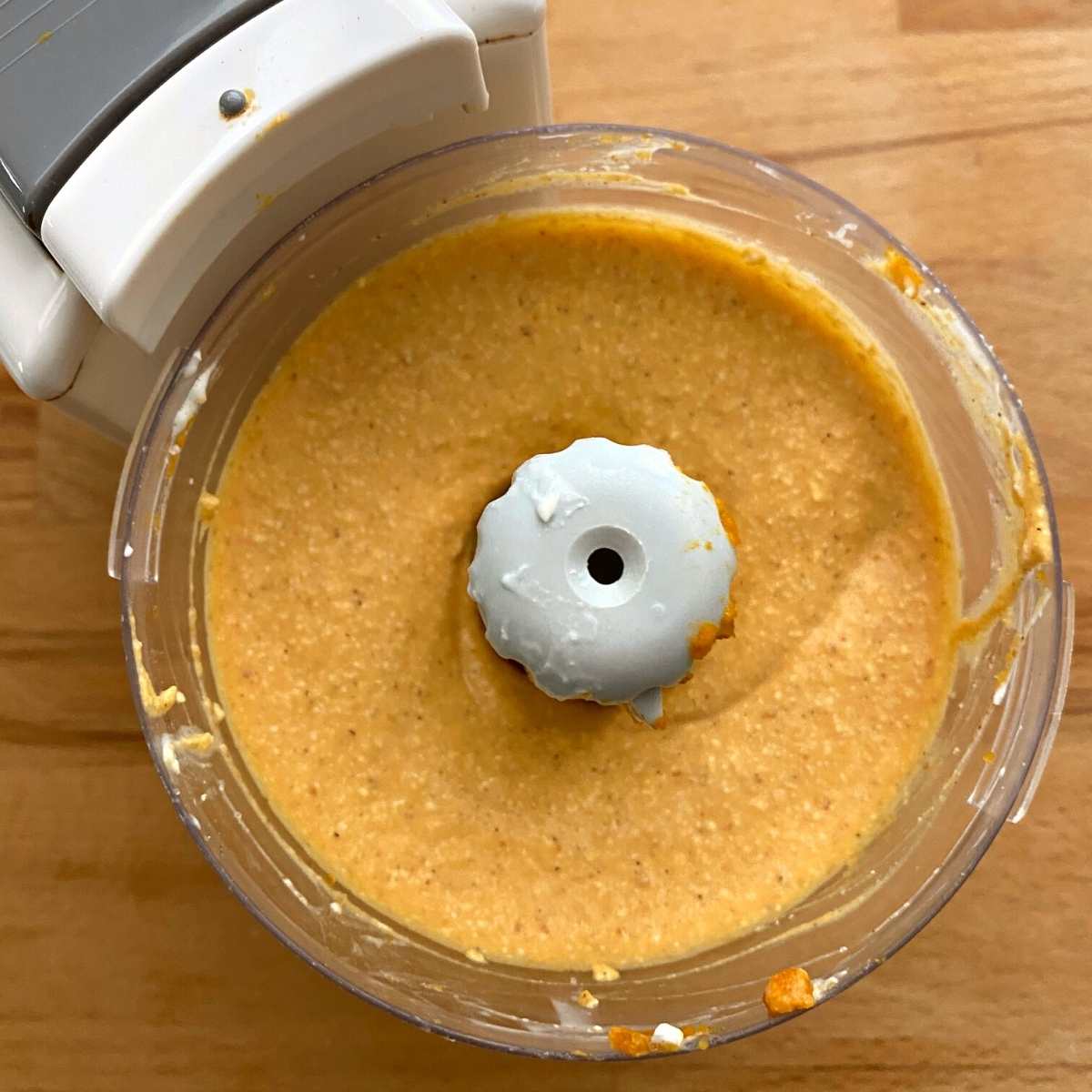 Whipped pumpkin cottage cheese in a small food processor bowl. 