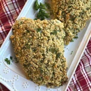 Fancy herb crusted turkey tenderloin on a platter.