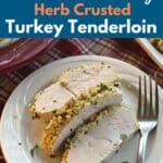 Three slices of herb crusted turkey tenderloin on a plate.