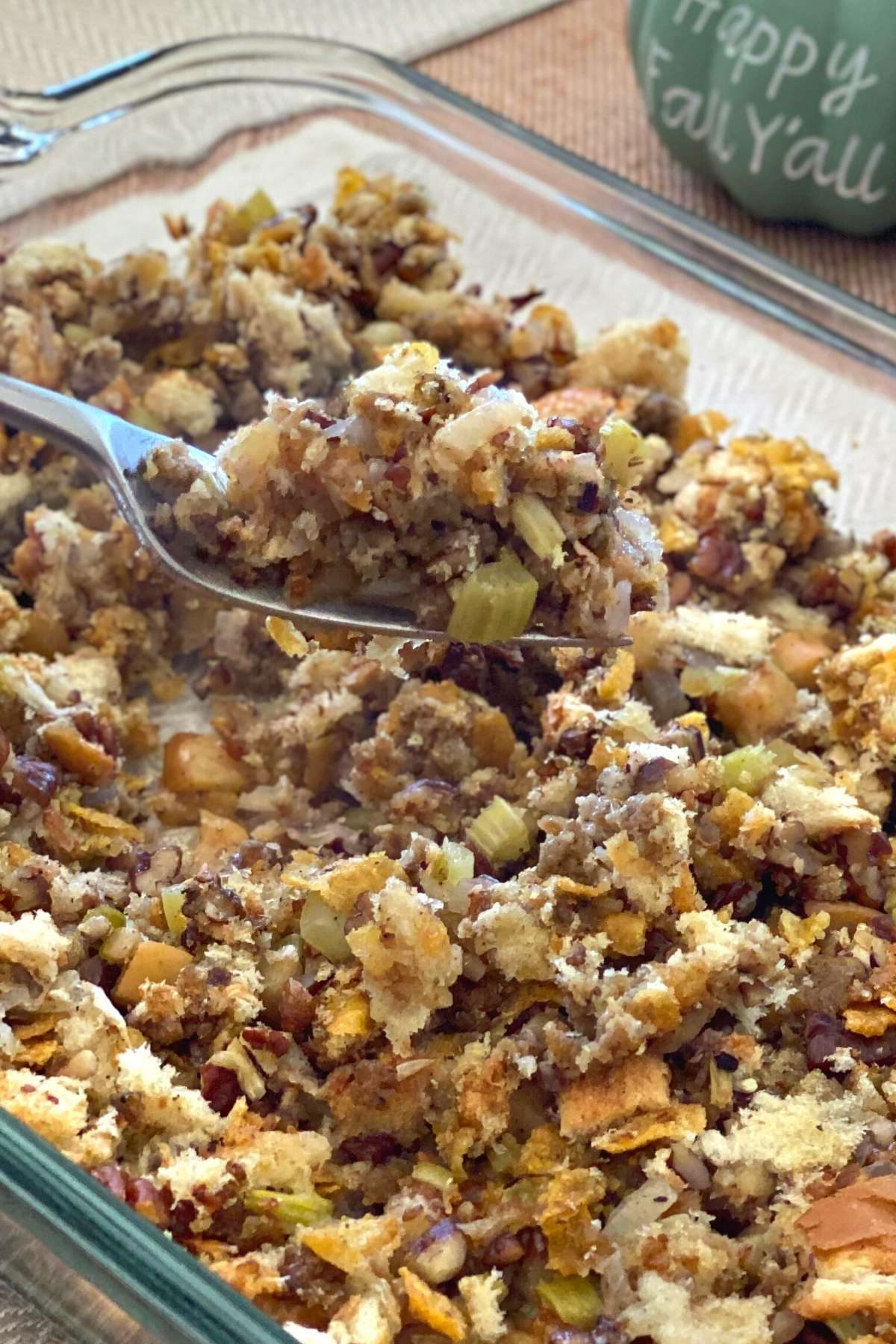 Make-ahead Oven Baked Stuffing made with fresh bread, apples, and pecans, in a casserole dish.
